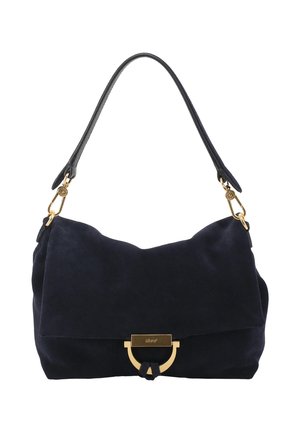 Black suede shoulder bag with a single strap, gold hardware clasp, and minimalist design against a white background.