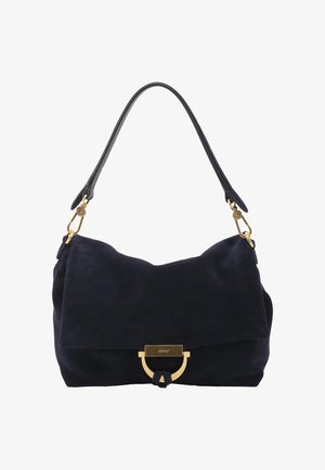 Black suede shoulder bag with a single strap, gold hardware clasp, and minimalist design against a white background.