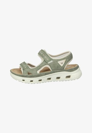 Groene suède sandalen met verstelbare banden, witte accenten, gevoerd voetbed en een witte rubberen zool met ventilatiegaatjes.