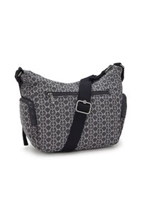 Black and gray patterned shoulder bag made of fabric, featuring a zip closure, adjustable strap, and multiple exterior zip pockets.