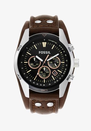 Fossil wristwatch with black dial, brown leather strap, three subdials, date window at 4 o'clock, and silver case with tachymeter scale.