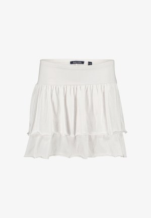 Mini-jupe blanche à volants en tissu doux. Dotée d'une ceinture élastique et de deux couches à volants avec une texture lisse. Étiquette de la marque visible.