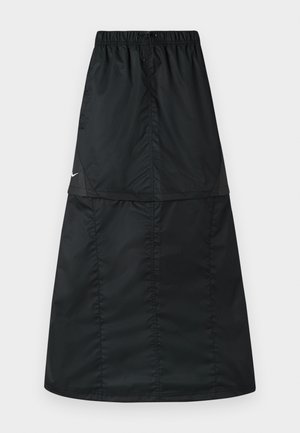 Μαύρη αθλητική φούστα από ελαφρύ, λείο νάιλον ύφασμα. Διαθέτει ελαστική μέση και απλό, μακρύ, σε σχήμα Α κόψιμο.