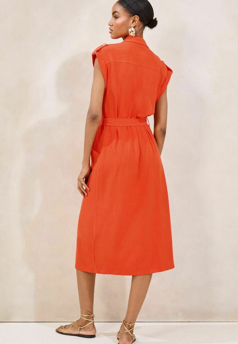 strapless open back dress Luca Petite Orange Frill Smock Dress – The Fashion Bible