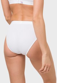 White high-waisted panties made from smooth fabric, featuring a clean design with an elastic waistband and no visible patterns.