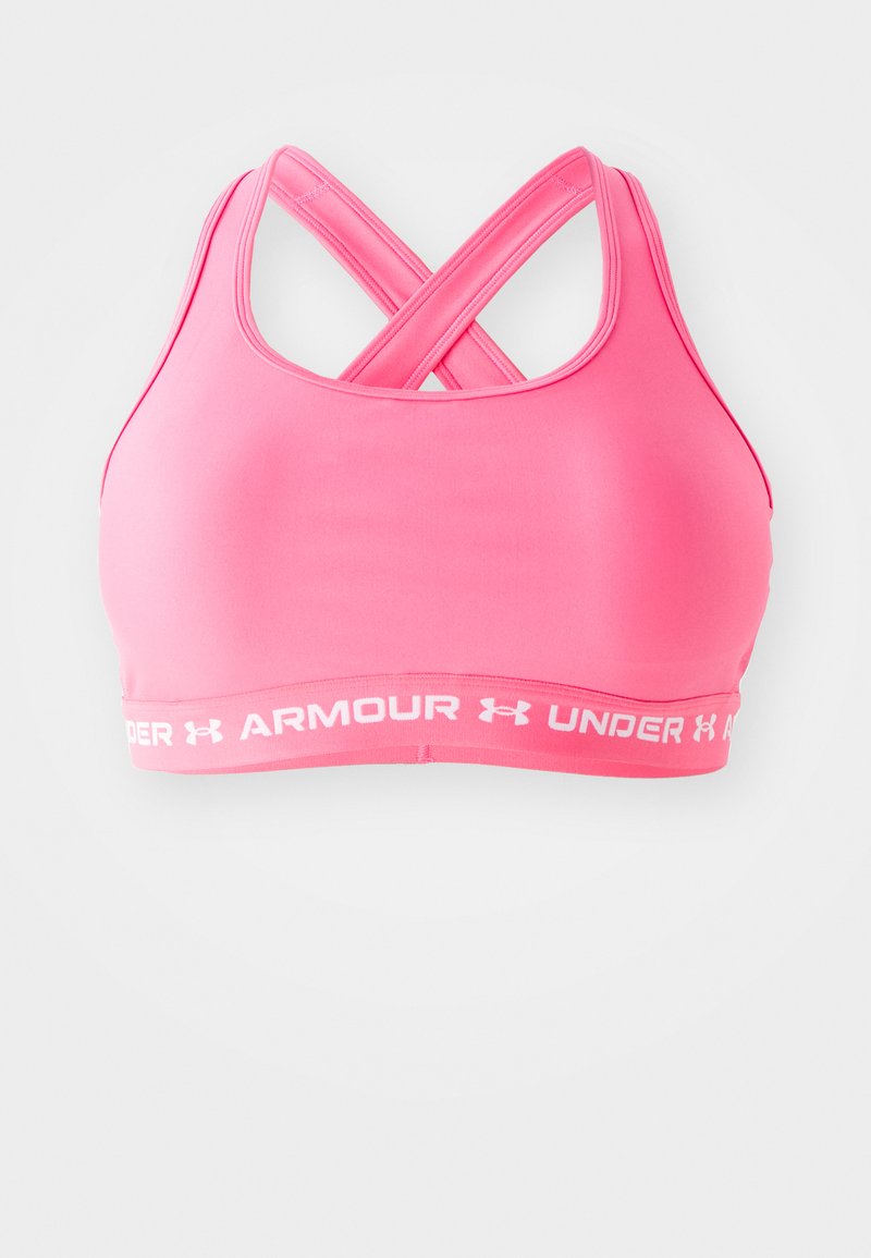 Roza sportska grudnjak s ukriženim trakama i bijelim Under Armour logom na traku. Izrađen od glatkog, rastezljivog materijala za udobnost.