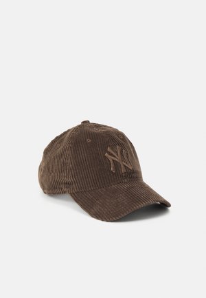 Brown corduroy baseball cap with embossed NY logo on front, displayed on white background.