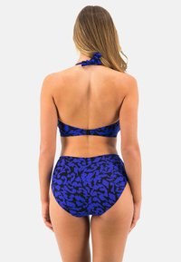 Blue bikini set featuring a halter neck and high-waisted bottom. The fabric has a black abstract pattern. Adjustable tie at the neck.
