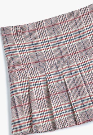 Woven plaid skirt in cream, red, and navy blue colors. Features pleats and a textured fabric, with a checked pattern throughout.