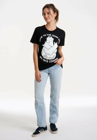 Black cotton t-shirt featuring a white graphic of a cookie monster holding cookies, with text “Come to the dark side, we have cookies.”
