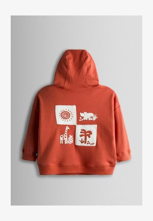 Terrakotanvärinen huppari, jossa edessä tasku. Valkoisilla kirjotulla neliökuviolla, joissa on eläimiä ja aurinko. Pehmeä puuvillakangas, normaalimallinen.