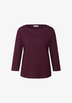 Burgundy long-sleeve shirt with a boat neckline, made of soft fabric. Features fitted sleeves and a straight hem. No patterns or hardware.