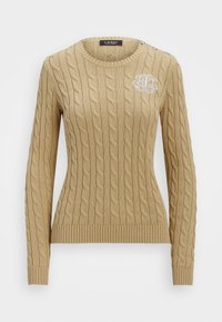 Beige kabelstickad tröja med rundhals, långa ärmar, ribbat avslut och knappdetaljer på axlarna. Har en broderad logotypdetalj.