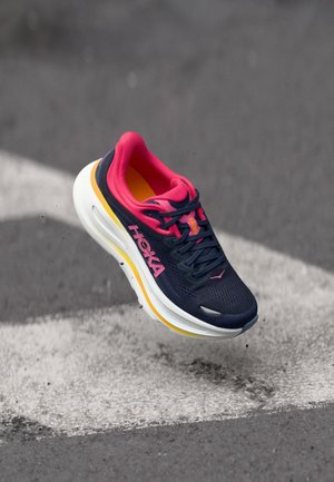 Blue running shoe with pink accents and yellow sole. Features a breathable mesh upper, cushioned white midsole, and lacing system.