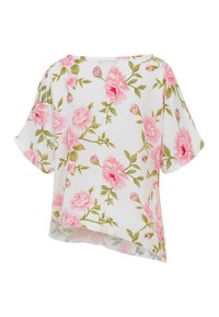 Blouse blanche à manches courtes avec motif floral de roses roses et feuilles vertes, présentant un ourlet asymétrique.