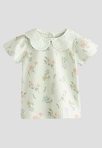 Lyst grønt kortærmet skjorte med blomstermønster og ribbet tekstur. Har en hvid øjelet krave og knaplukning bagpå.