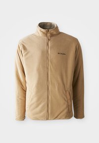Beige Columbia fleece jacket with full front zipper, stand collar, two side pockets, and soft textured fabric.