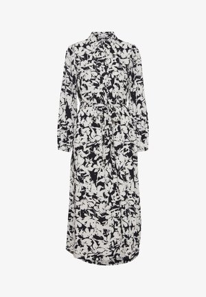 Pitkähihaisessa, kauluksellisessa mekossa on musta-valkoinen kukkakuosi. Siinä on vyöllä varustettu vyötärö, napitus edessä ja pehmeä kangas, joka luo valuvaa siluettia.