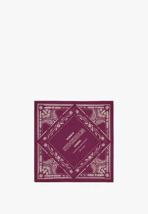 Dunkelviolettes Bandana mit weißen Paisley-Mustern und Text in der Mitte mit dem Schriftzug "Founded in Stockholm Authentic Scandinavian design brand."
