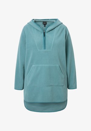 Vaaleansininen fleece-huppari, jossa on puolivetoketju etuosa, suuri etutasku ja pidempi takasauma. Hupparissa on pehmeä pinta ja rento muotoilu.