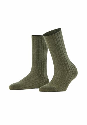 Olivgrüne gerippte Socken mit mittlerer Höhe, aus einem strukturierten Baumwollgemisch gefertigt, mit verstärkter Zehen- und Fersenpartie für Langlebigkeit.