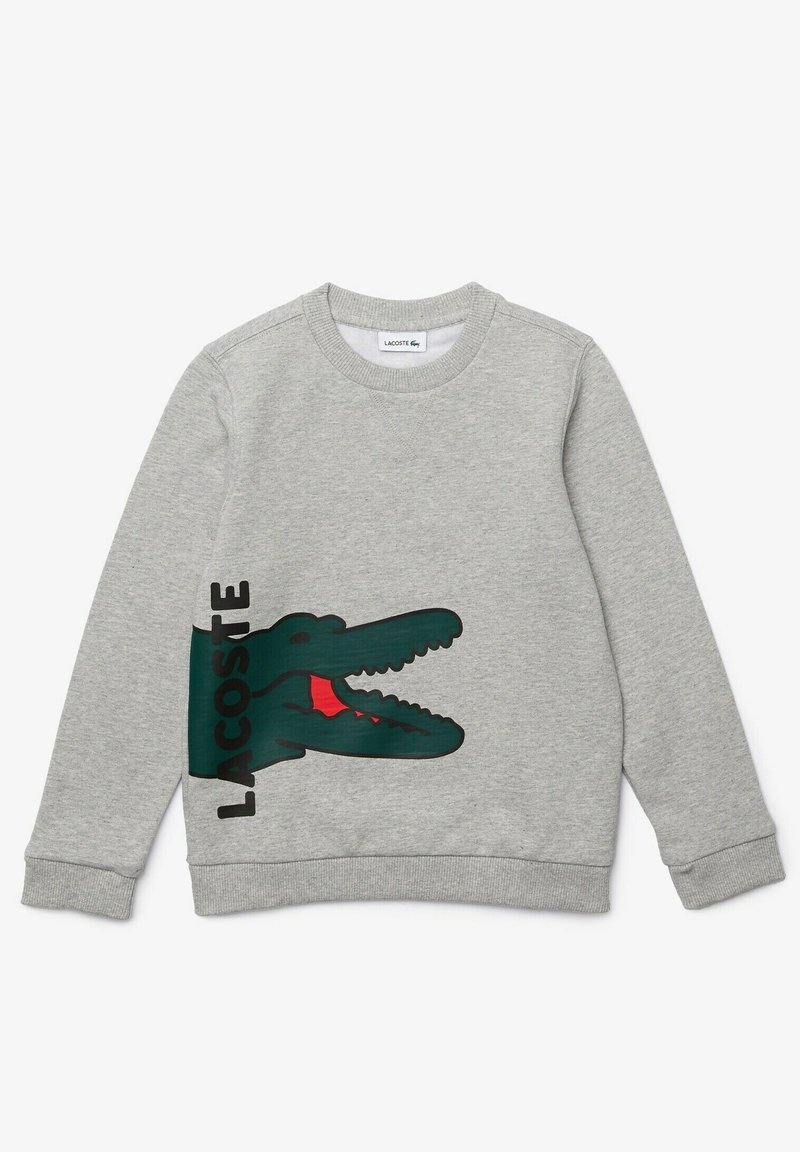 Gray crewneck sweatshirt made of cotton, featuring a large green crocodile graphic with a red mouth and the word "LACOSTE" printed in black.