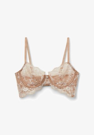 Beige lace bra with sheer floral lace cups, underwire support, adjustable thin straps, and a small decorative pearl detail in the center.