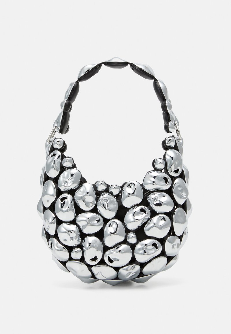 Metallic silver and black bag, with rounded, pebble-like textures. Features a thick, curved handle and smooth, reflective surface.