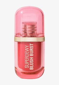 Botella translúcida rosa con una tapa redondeada, banda dorada y etiquetada como "SUPERDEWY BLUSH BURST"; contiene un líquido de color rosa coral en su interior.