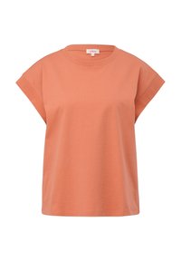 T-shirt en coton couleur pêche à manches courtes, col rond et coupe décontractée, présenté sur un fond blanc uni.