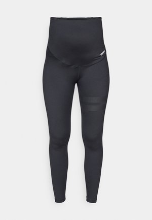 Leggings noirs taille haute en tissu extensible, présentant une texture lisse et deux bandes en mesh horizontales sur le bas de la jambe.
