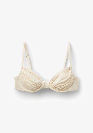 Cream-colored satin bra with ruched cups and adjustable shoulder straps on a white background.