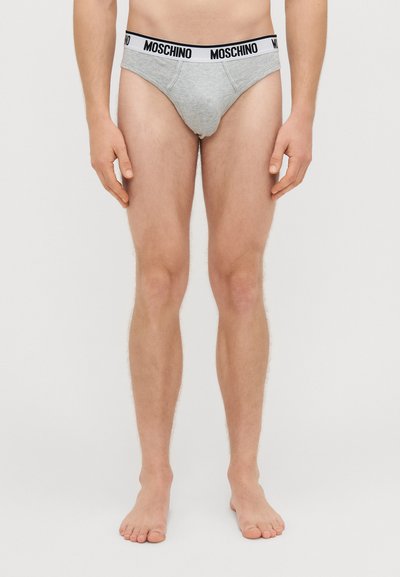 Hallid puuvillased aluspüksid musta ja valge Moschino logo vöökohtadega, omades mugavat istuvust ja tavalist lõikekujundust.
