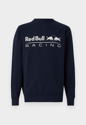 Navy blauwe sweatshirt met lange mouwen van katoen, met een ronde hals en een groot wit "Red Bull Racing" logo op de voorkant, vergezeld van twee stier graphics.