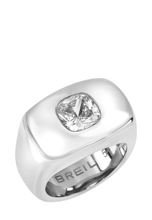 Sølvring med glatte, afrundede kanter og en pudeformet klar stenindfatning. Indgraveret mærkenavn "BREIL" synligt indvendigt.