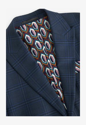 Dark blue plaid blazer with a textured fabric. Interior features a geometric pattern in orange, teal, pink, and cream on a dark backdrop.