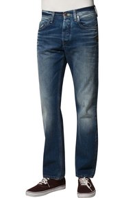 Tumman siniset farkut suoralegisellä mallilla, vaaleaa kulutusta reisillä, viisi taskua ja metalliset yksityiskohdat.