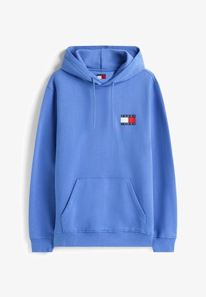 Sudadera con capucha de color azul claro, con bolsillo frontal y parche del logo de Tommy Jeans en el lado izquierdo del pecho.
