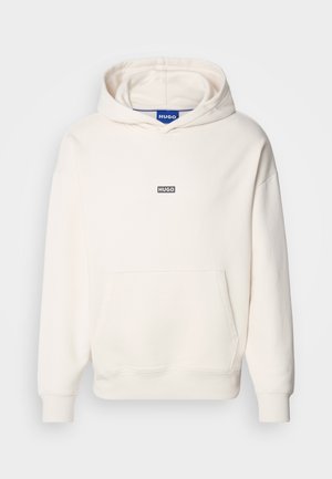 Light cream hoodie made of cotton blend, featuring a large front pocket, ribbed cuffs, and a small black "HUGO" logo on the chest.