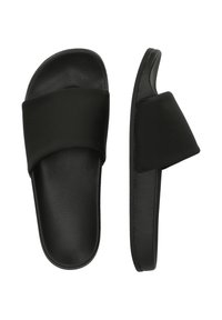Black slide sandals with a wide, matte strap and a textured footbed. Features a smooth sole with a rounded toe and open back design.