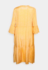 Abito midi giallo con motivo floreale, maniche lunghe con polsini arricciati e design a strati. Tessuto morbido con una vestibilità comoda.