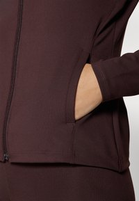Under Armour Trainingsjacke - brown