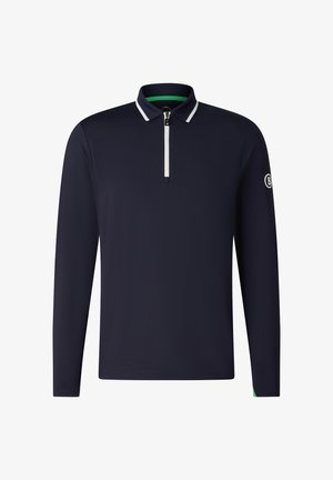 Polo à manches longues bleu marine avec une fermeture éclair blanche et un liseré au col, arborant un petit logo sur la manche gauche.