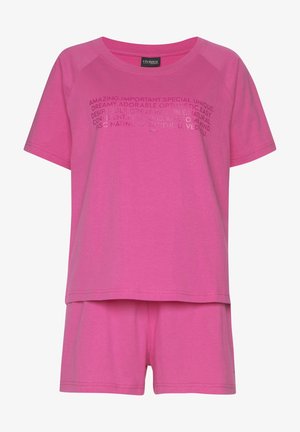 Set di pigiama rosa a maniche corte con un fit rilassato, scollatura rotonda e design con testo grafico sulla maglietta. Materiale in cotone morbido.