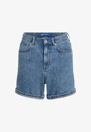 Zili džinsi īsās bikses vidēji zilā krāsā ar augstu jostasvietu, veidoti ar sarullētām malām, divām priekšējām kabatām un pogas aizdari. Uz jostasvietas redzams etiķete.