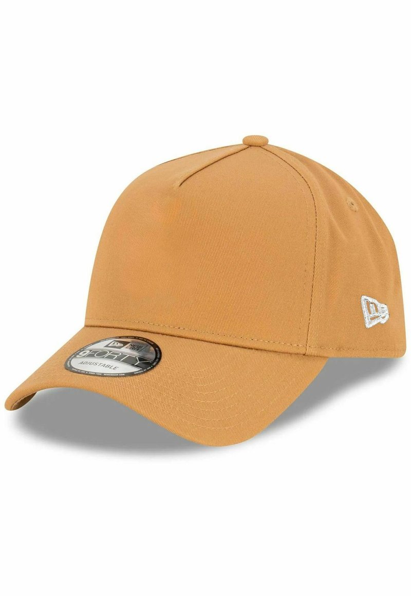 Adjustable cap in a mustard yellow color, made from textured fabric, with a curved brim and a logo patch on the side.
