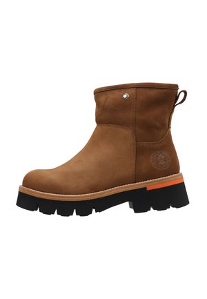 Brown suede ankle boot with a rounded toe, black chunky sole, and orange accent on the heel. Features a side logo and pull tab for ease.