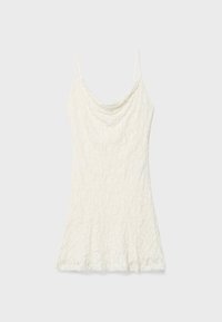 White lace camisole with thin spaghetti straps, featuring a draped neckline and flared hemline. Textured fabric with a floral pattern.