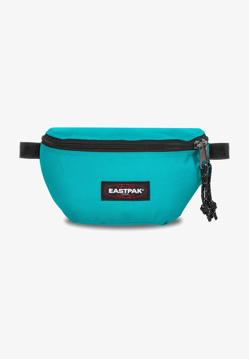 Tyrkis tygmidjeväska med en svart dragkedja och dragremmar. Har en Eastpak-logotyp på framsidan. Rundad form med justerbar rem.