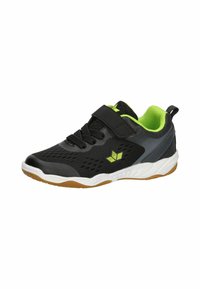 Black athletic shoe with mesh upper, green accents, and Velcro strap. Features a cushioned sole and rubber outsole for traction.